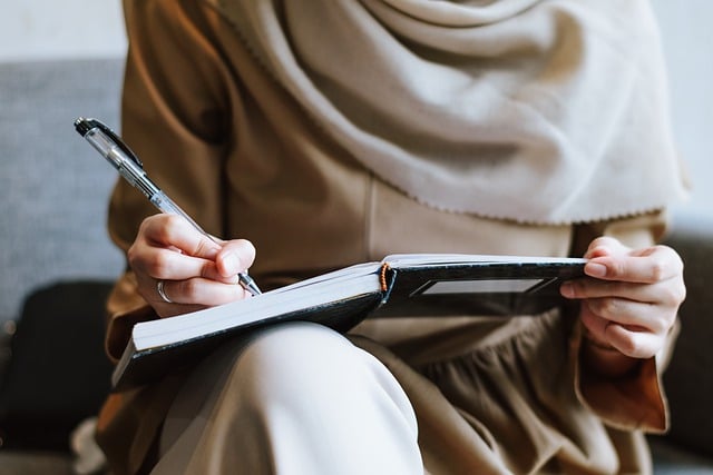 Woman writing in a notebook