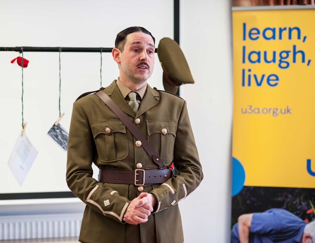 Picture of speaker in a military uniform