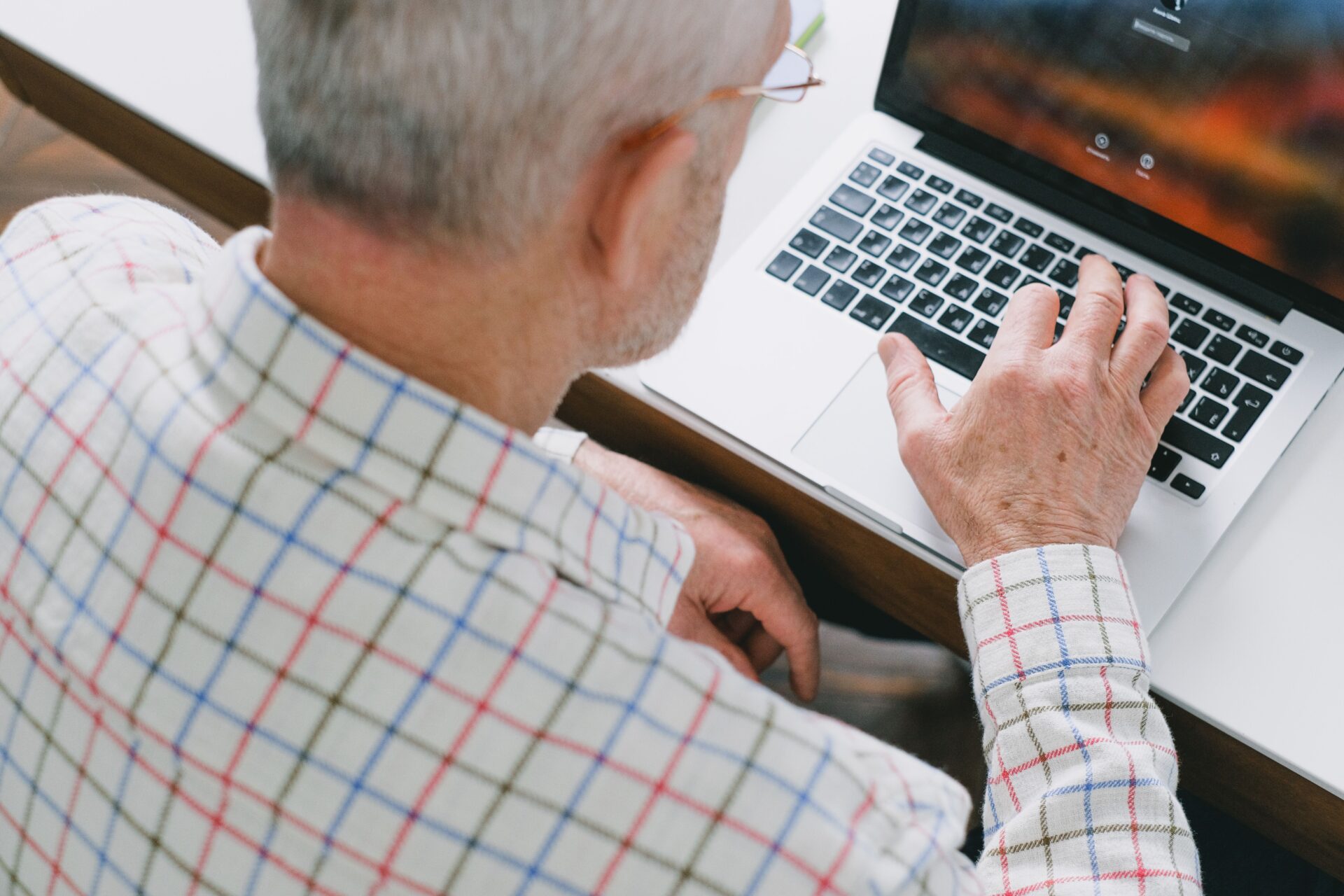 Older man using a lptop